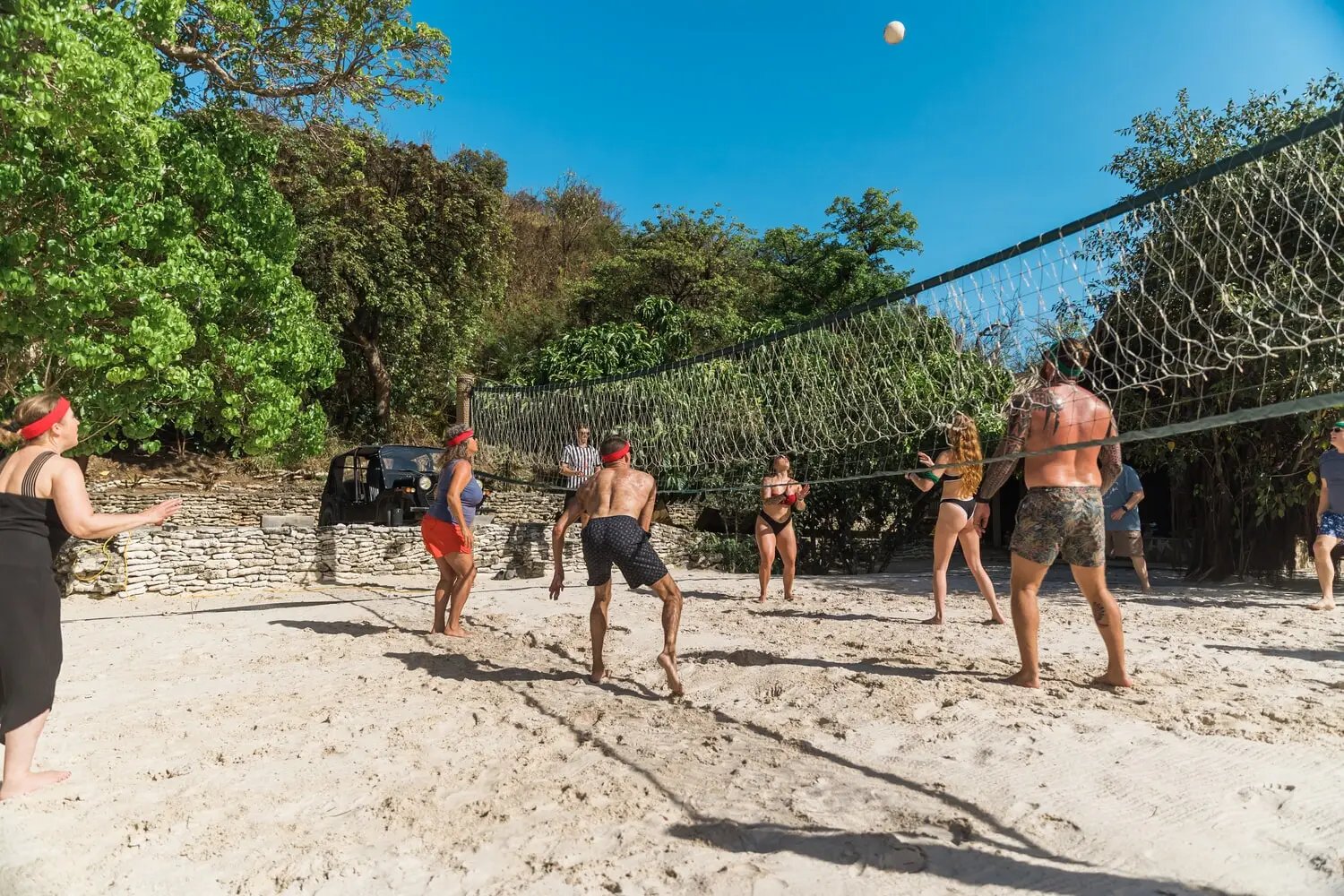 Guests playing beach volleyball at The Aerial, BVI