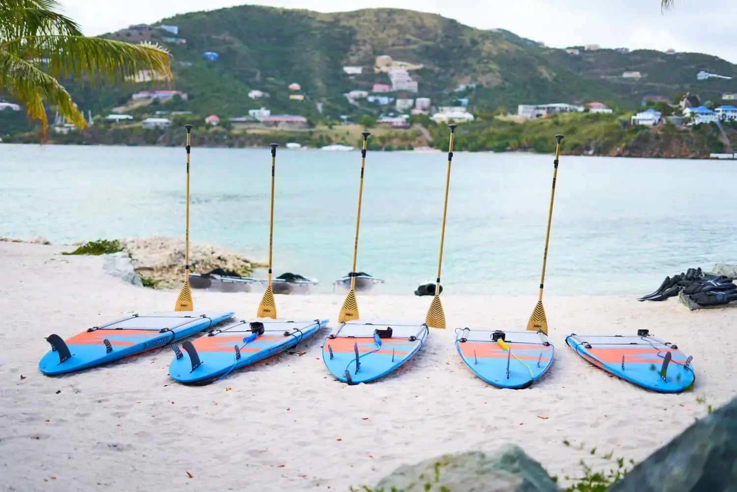 Row of paddleboards lined up on the beach at The Aerial, BVI.