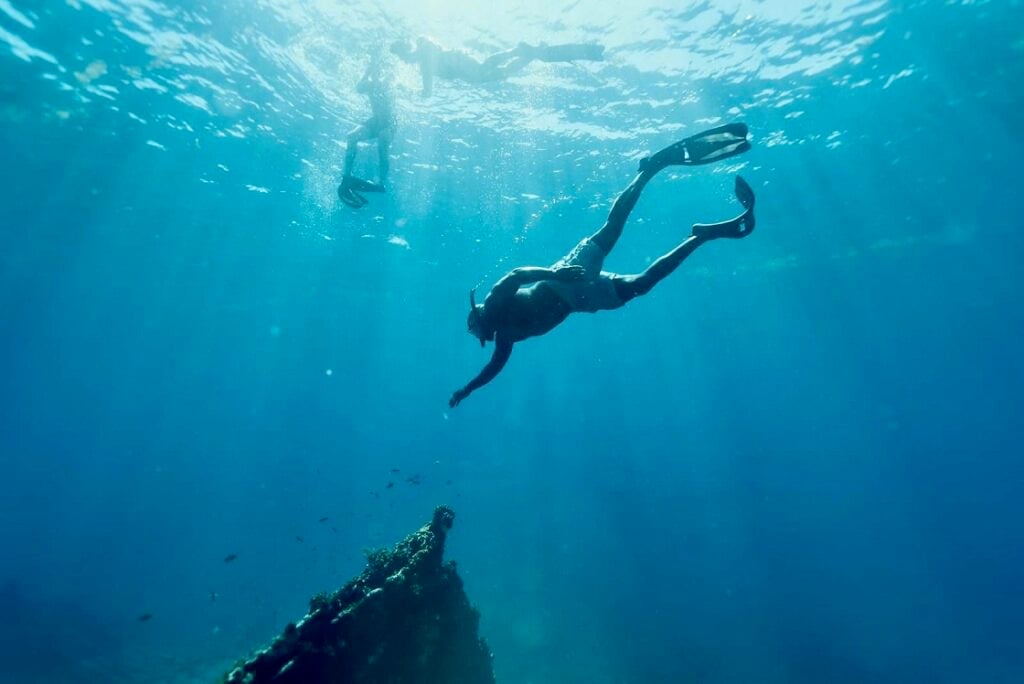 tourists snorkeling in Caribbean