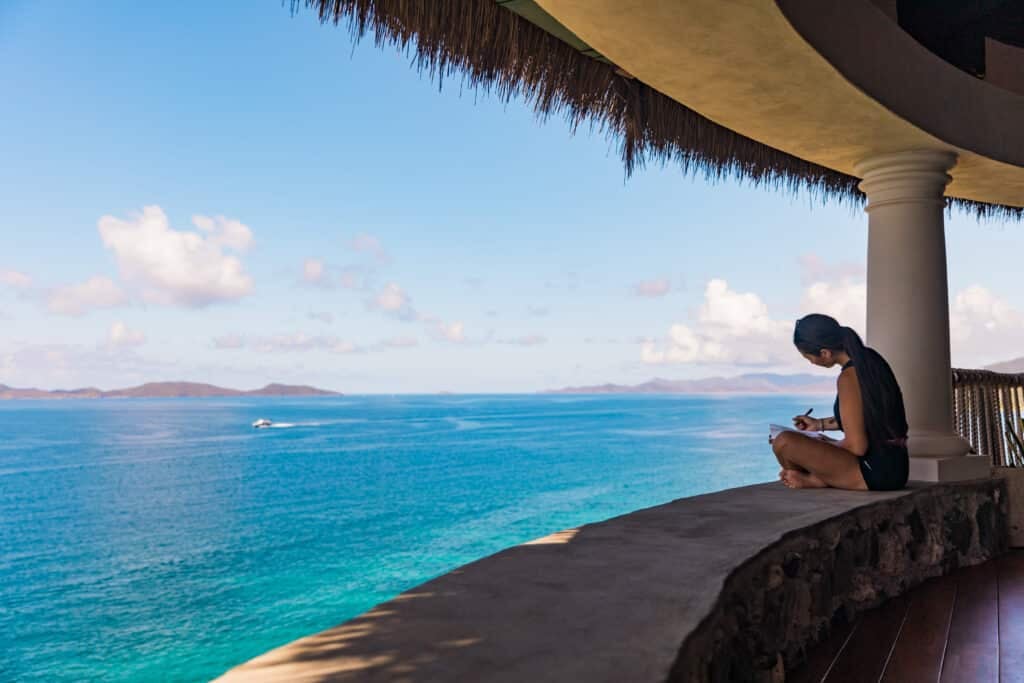 woman journaling as part of her silent retreat