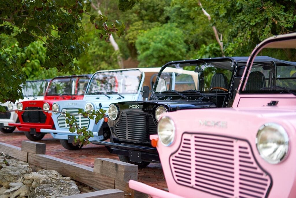 electric cars parked at ecoconscious resort in Caribbean