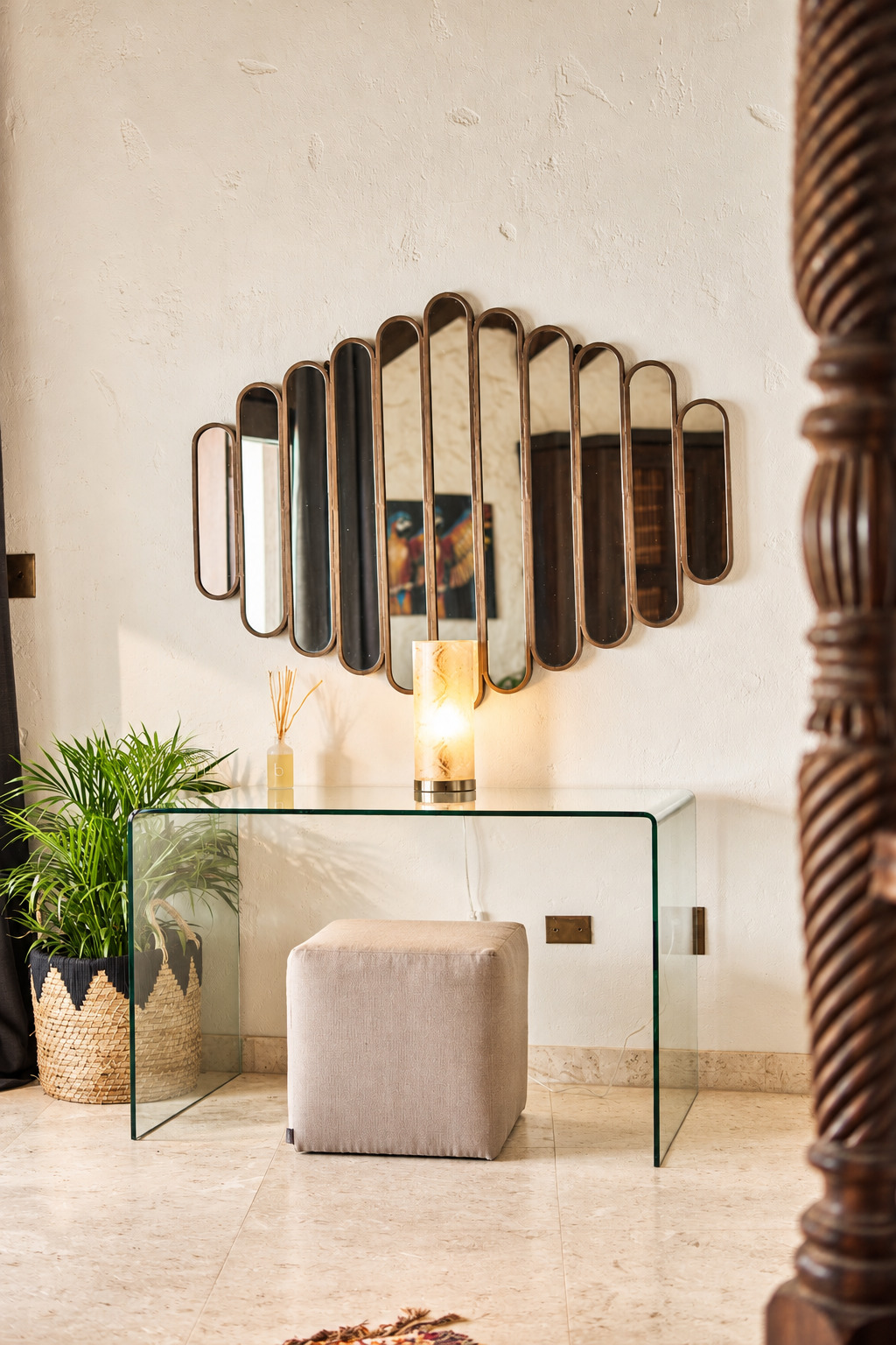 Entryway with fan-shaped mirror and glass console table at The Aerial, BVI