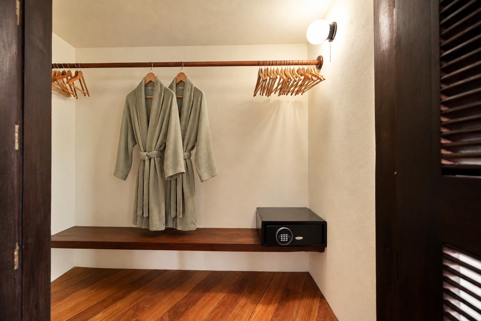 Closet nook with hanging rod and floating safe shelf.