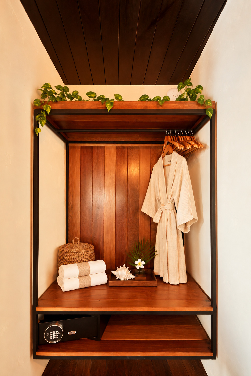 Entryway nook with built-in closet and woven pendant light.