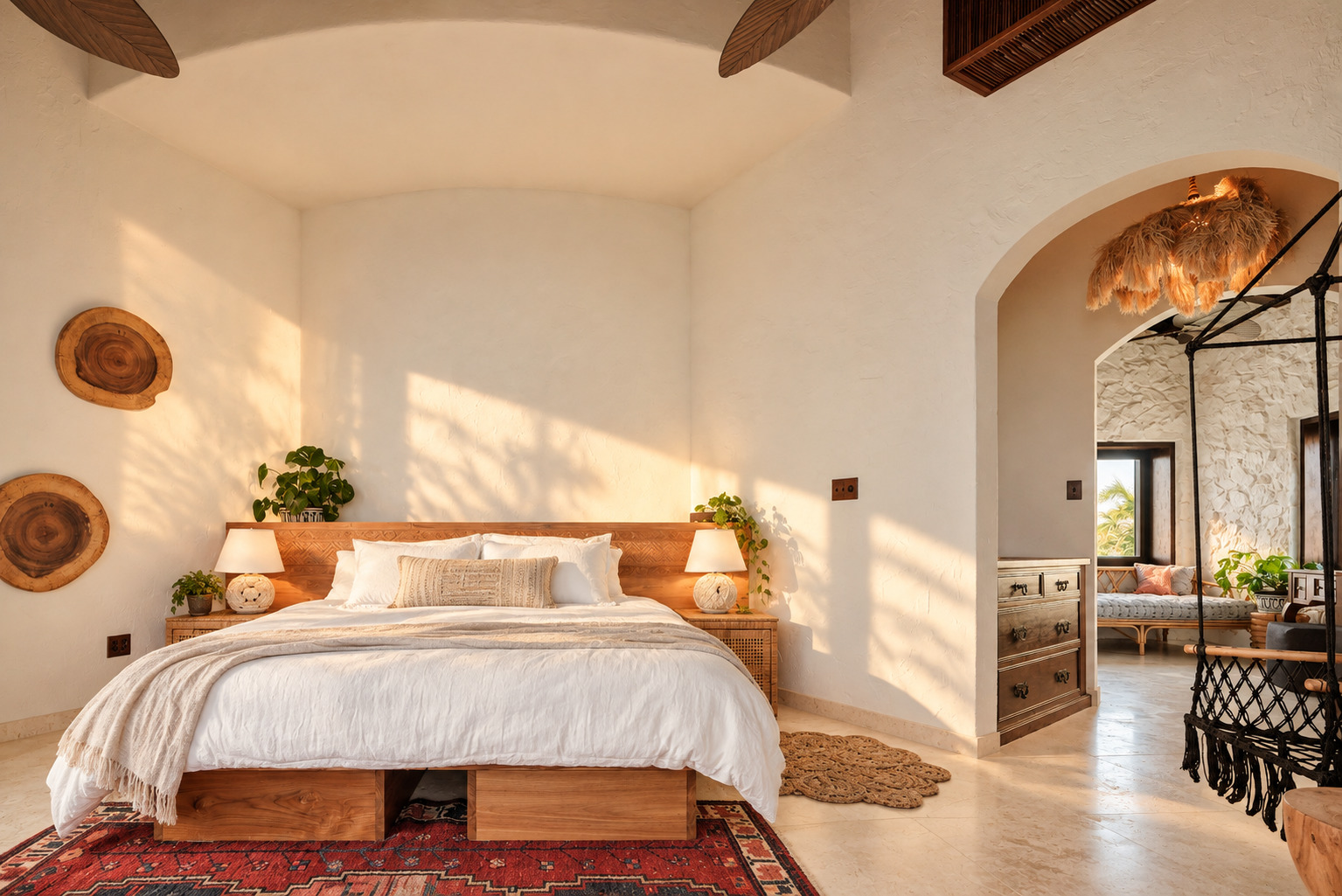 King bed with hanging chair and lounge area at The Aerial, BVI