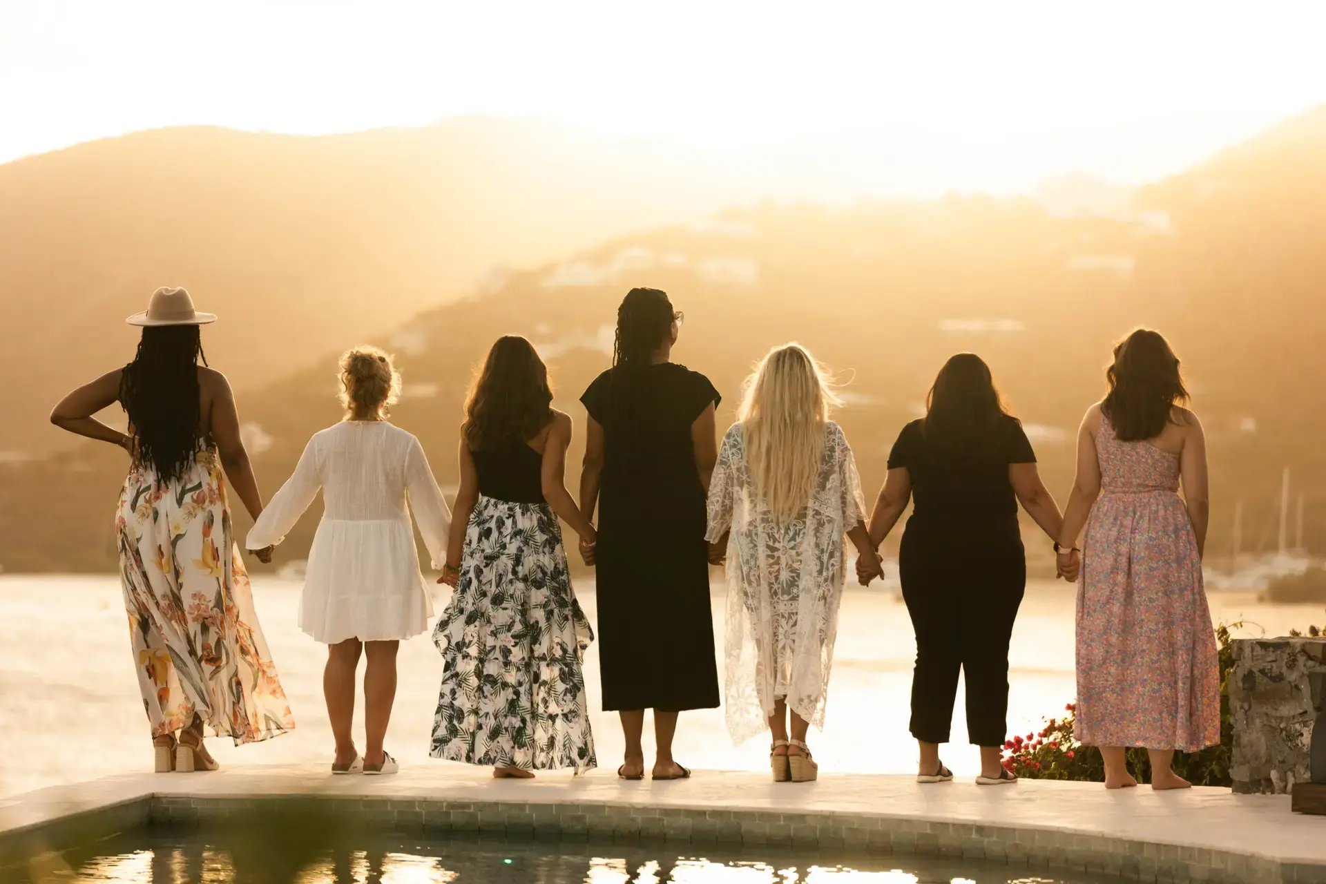 Group of women holding hands during a retreat at The Aerial, BVI
