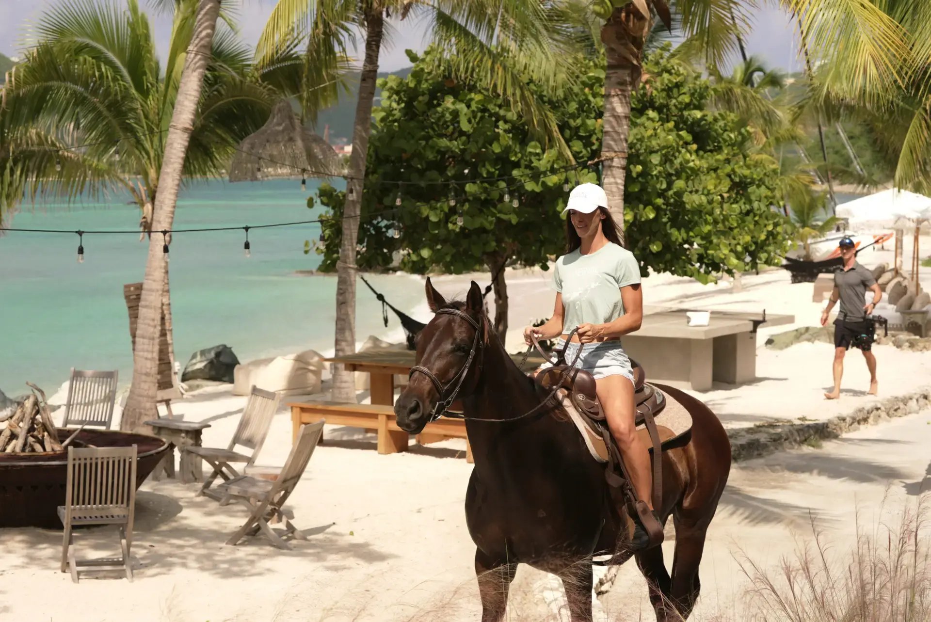 Guest horseback riding along the beach at The Aerial BVI