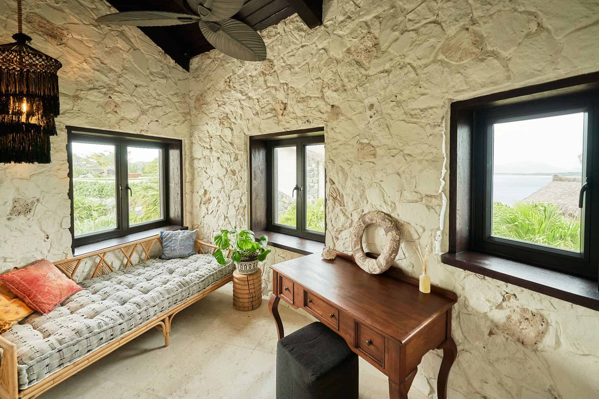 Reading nook with daybed and ocean-view windows at The Aerial, BVI