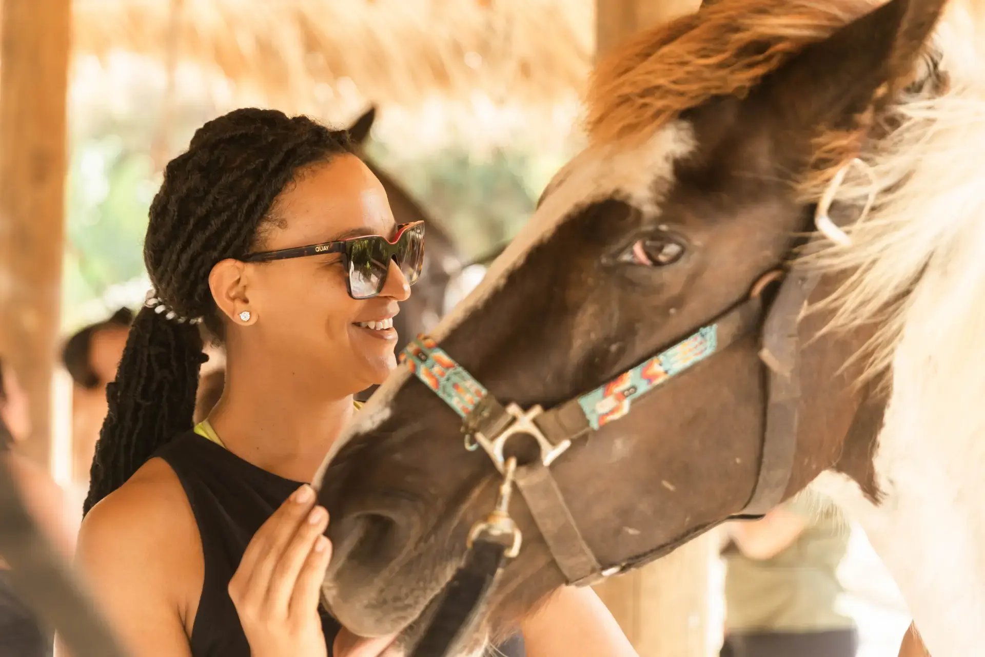 Woman bonding with a horse at Redemption Ranch, The Aerial BVI