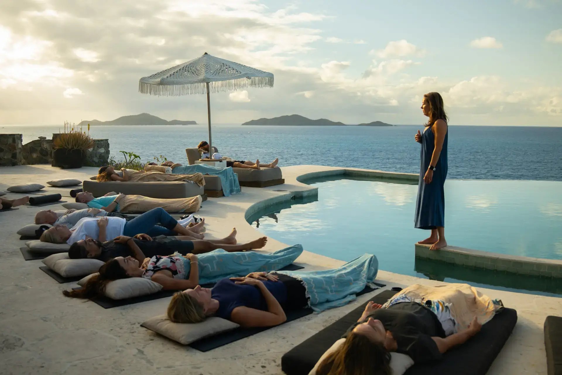 Guests in a poolside meditation session at The Aerial, BVI