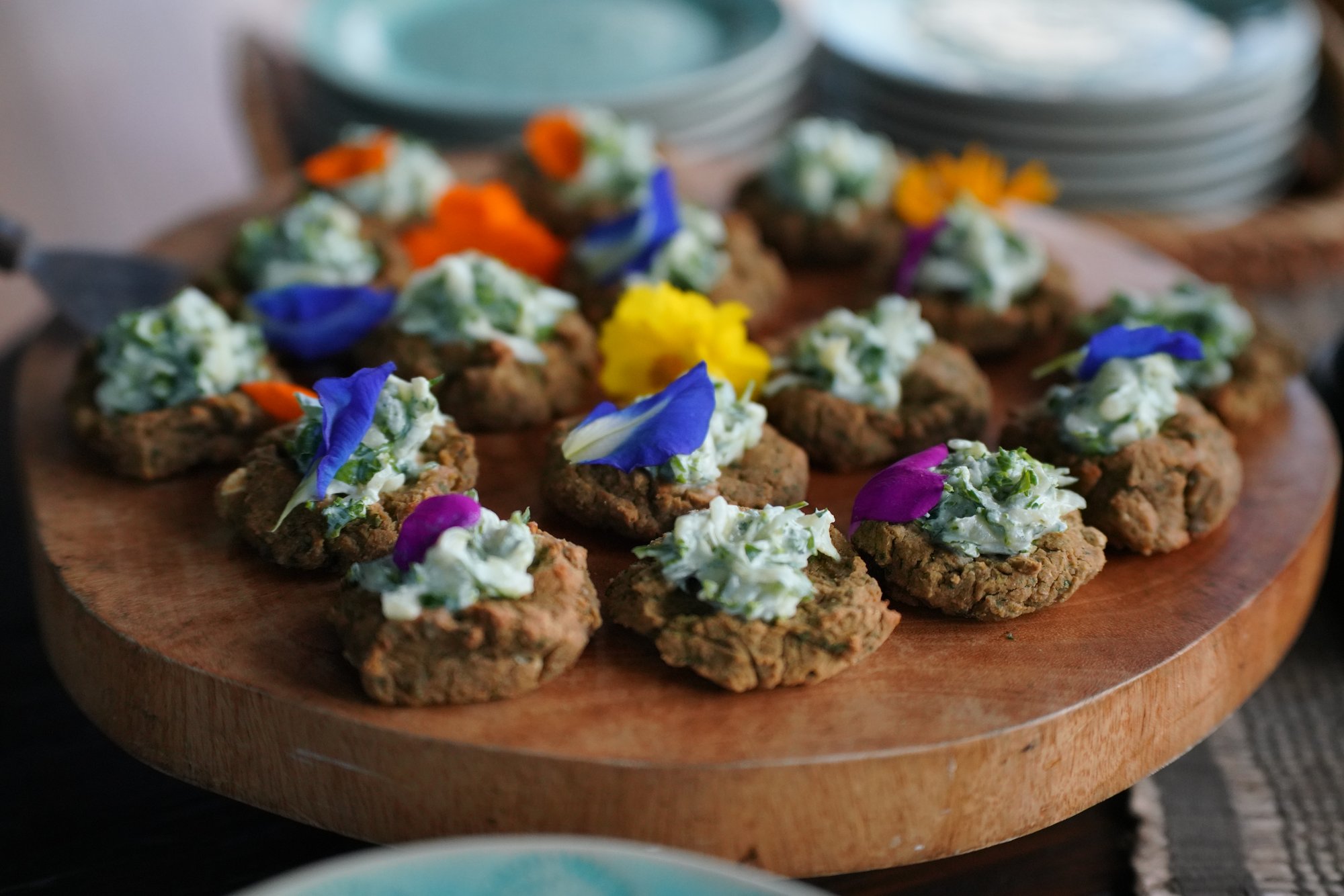 Herb-topped appetizers garnished with edible flowers at The Aerial BVI