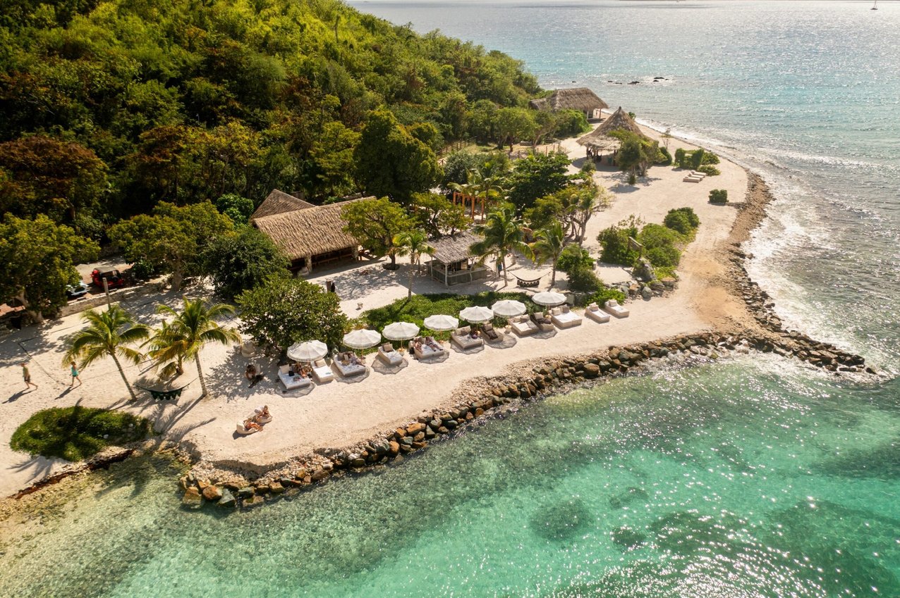 Aerial view of the beach and lounge area at The Aerial, BVI