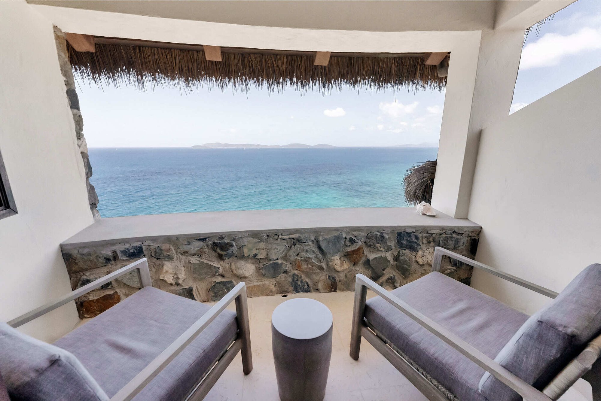 Private balcony seating with ocean view at The Aerial, BVI