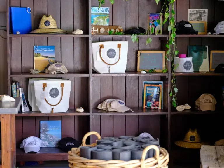 Branded welcome gift items displayed on shelves at The Aerial, BVI