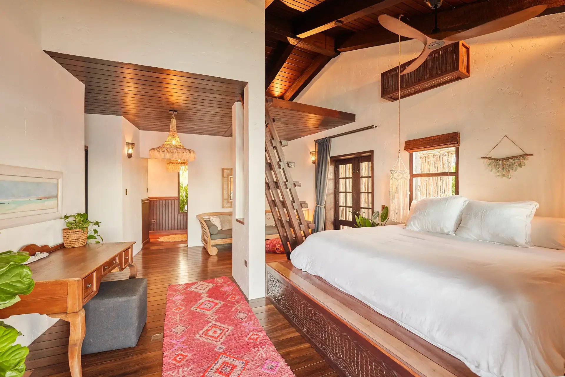 Bedroom suite at The Aerial, BVI with vaulted ceiling and king bed.
