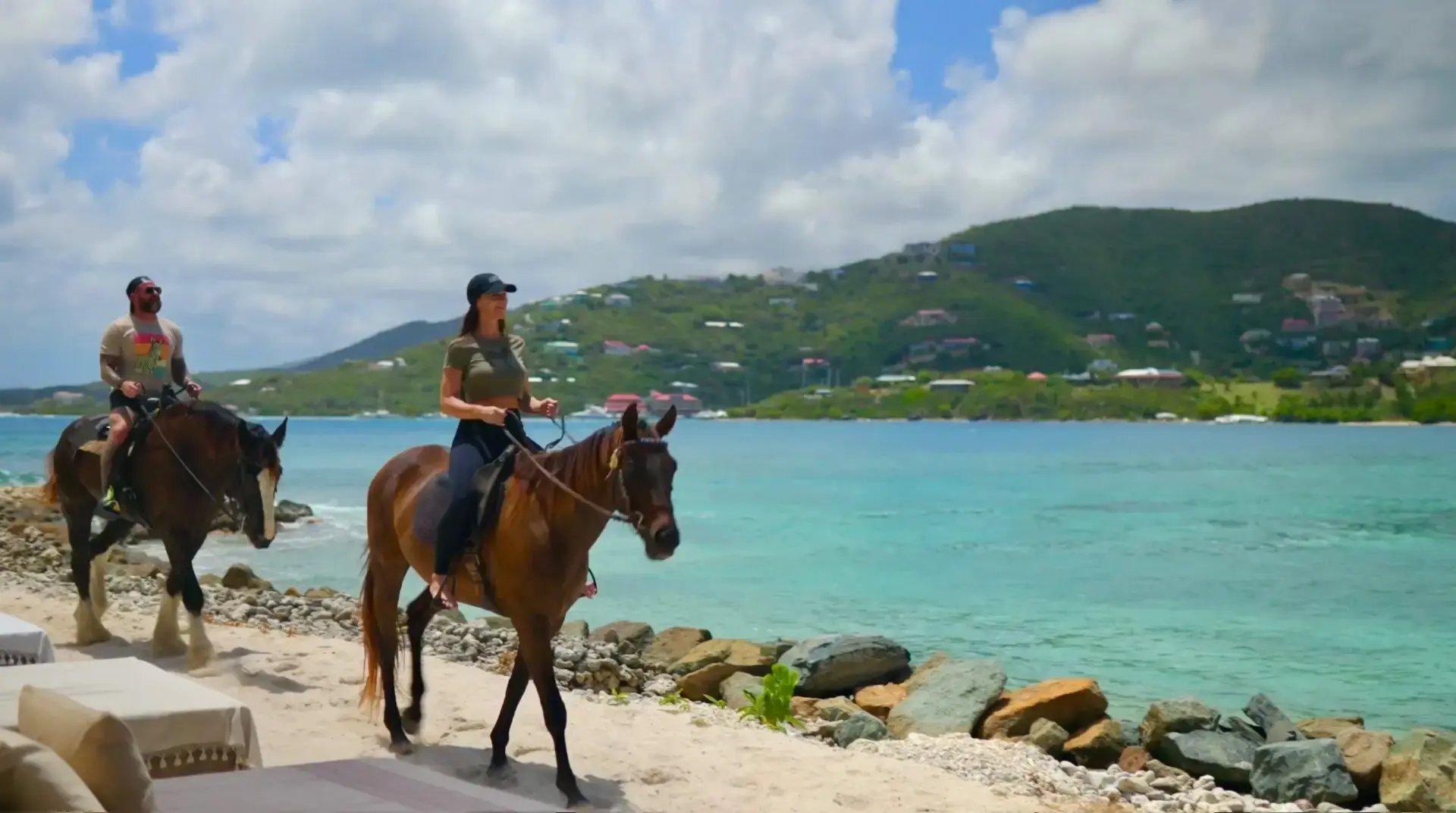 Guest horseback riding along the beach at The Aerial, BVI