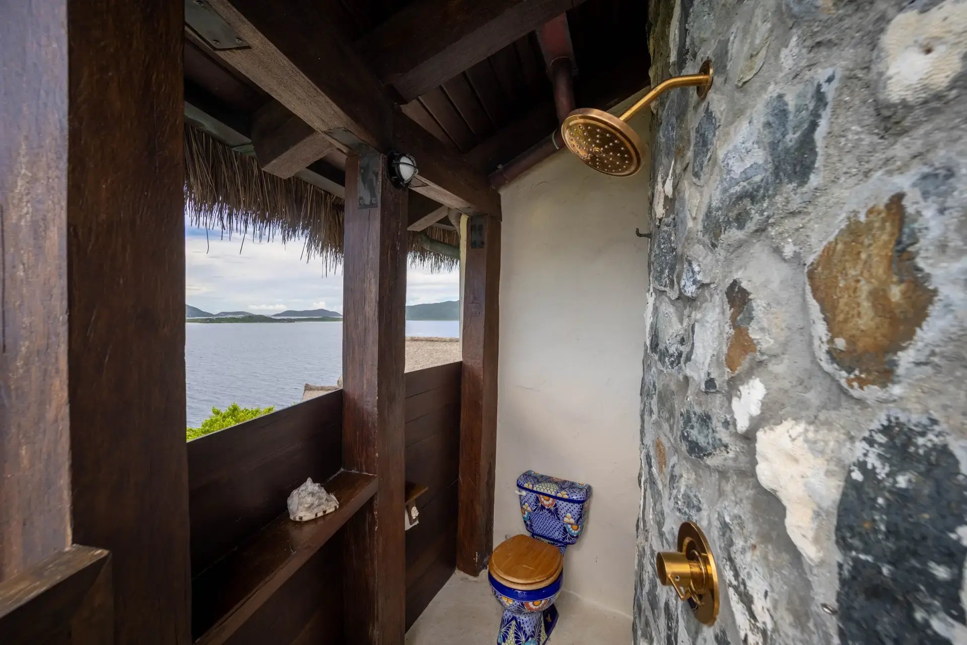 Outdoor shower and toilet area with ocean view at The Aerial, BVI