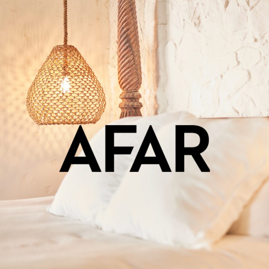 AFAR magazine logo over a bedroom interior