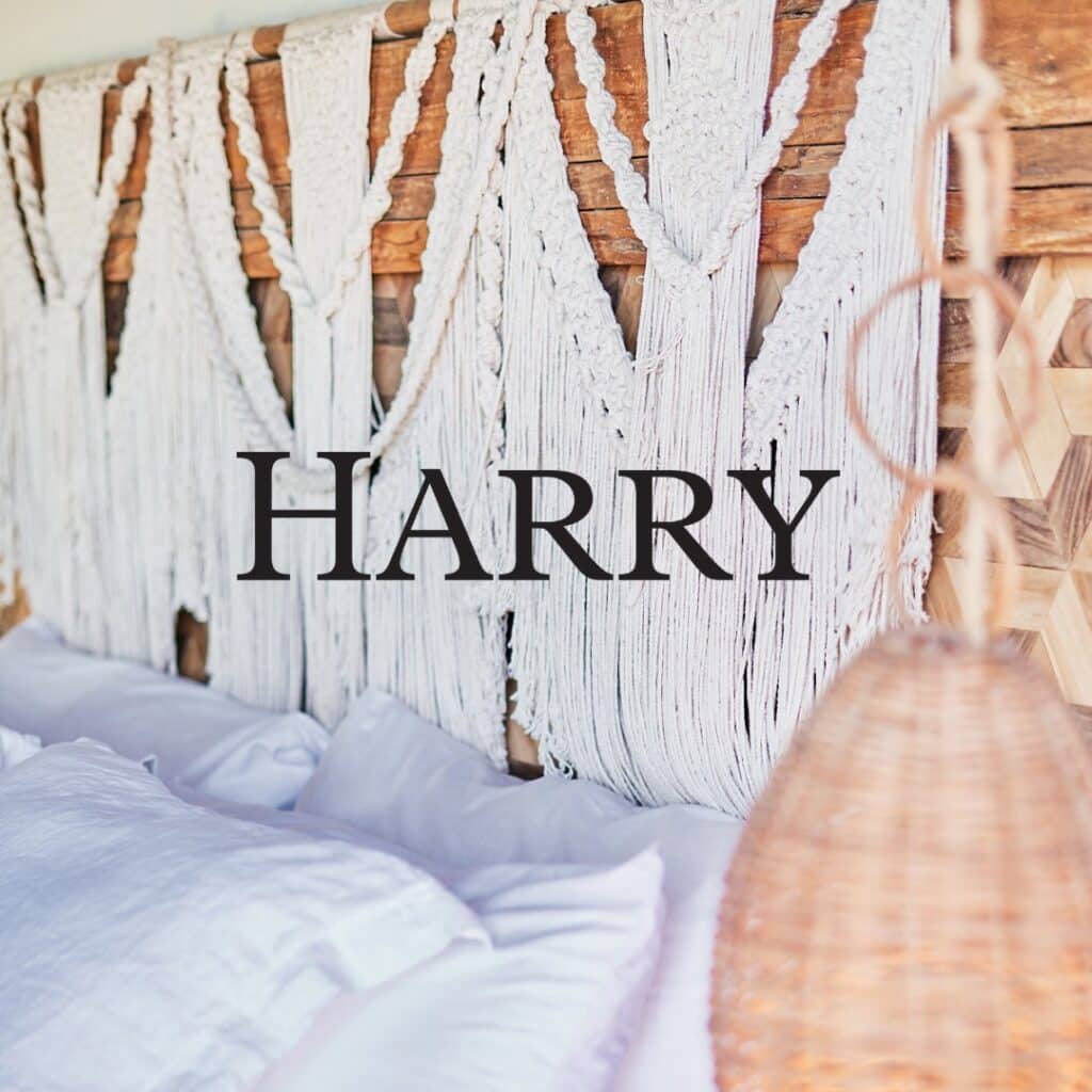 Woven wall hanging with 'Harry' text above a bed