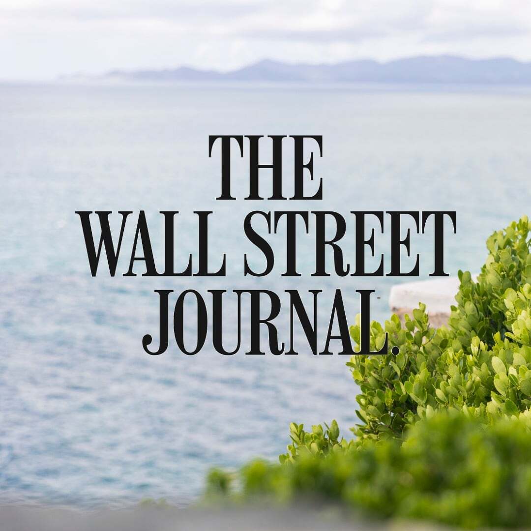 The Wall Street Journal logo over an island landscape