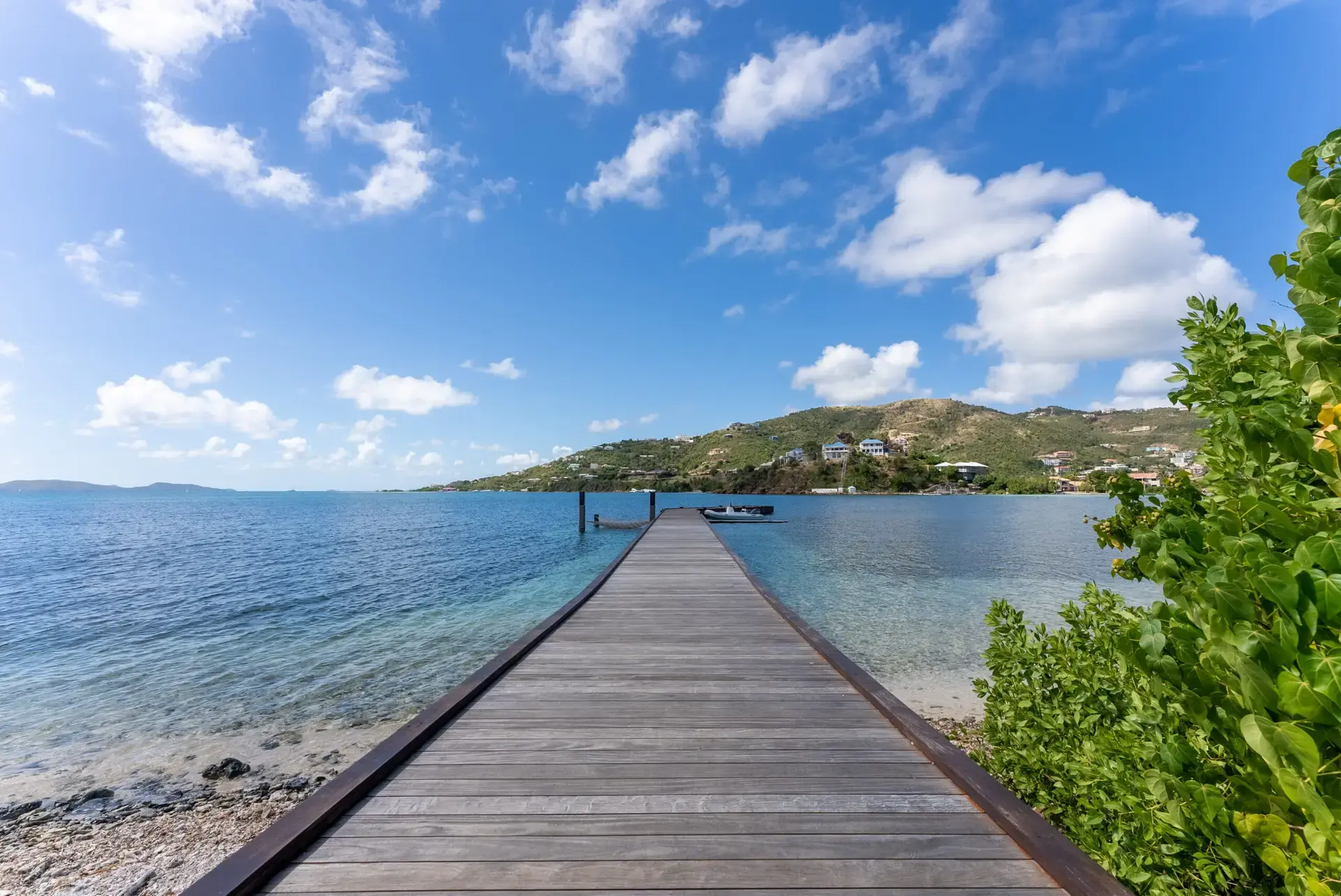 Wooden dock extending into the water near St. Thomas