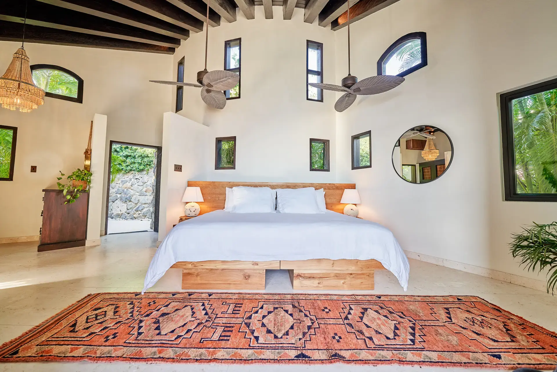 Guest room with high ceilings and beamed fans at The Aerial, BVI