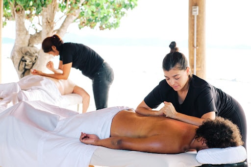 couple receiving spa massage as part of their luxury wellness experience at the Aerial BVI