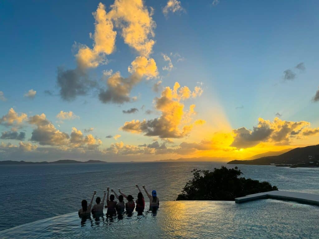 group of women in an infinity pool
