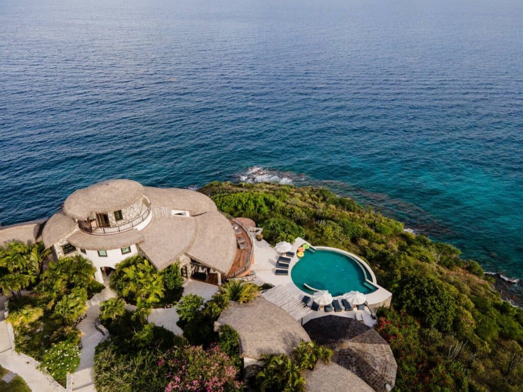 Aerial view of The Aerial, BVI private island wellness resort surrounded by the Caribbean Sea, designed to support alignment-based, non-invasive healing and nervous system regulation.